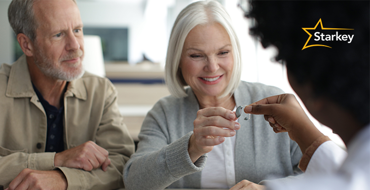 Image of woman looking at new hearing aids